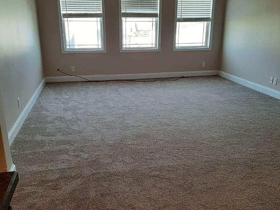 Captivating, open living area with natural streaming light, upgraded carpet, a soothing neutral paint color and ceiling fan. Perfect for relaxation and family fun.