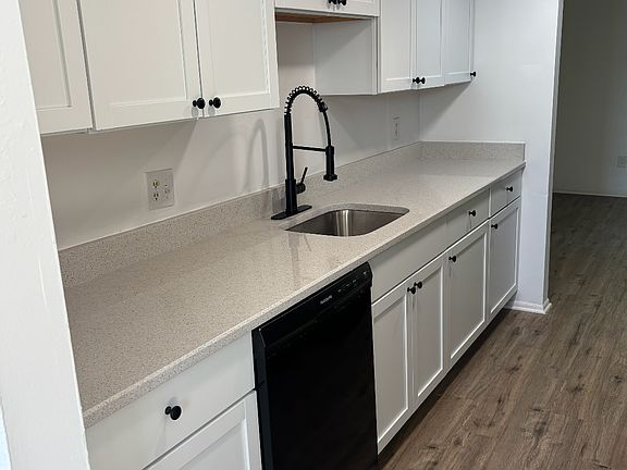 Brand new kitchen with quartz countertops.