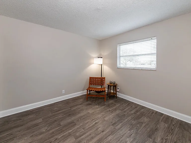 Experience pure delight in our bedrooms adorned with cozy wood-style flooring.