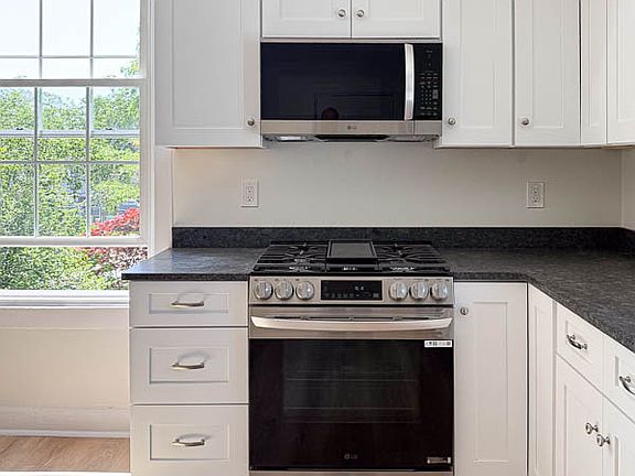 Shinny and new oven, microwave & fridge