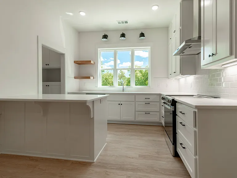 Kitchen with eat in bar. Plenty of natural light.