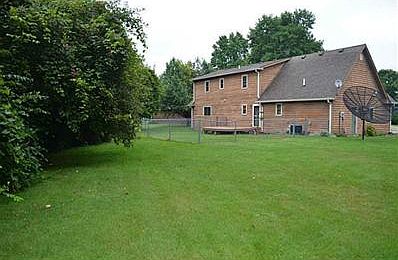 Exterior Back.  Home is located on a .30 acre Cul-de-sac lot with a fenced backyard.