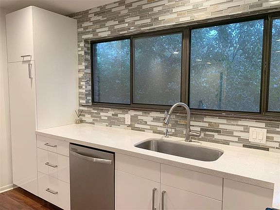 Stainless steel Dishwasher-2016 & Stainless steel sink with Brushed nickel faucet. Notice tall pantry closet.