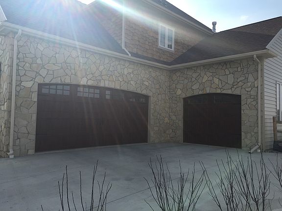 3 car garage w/ large doors