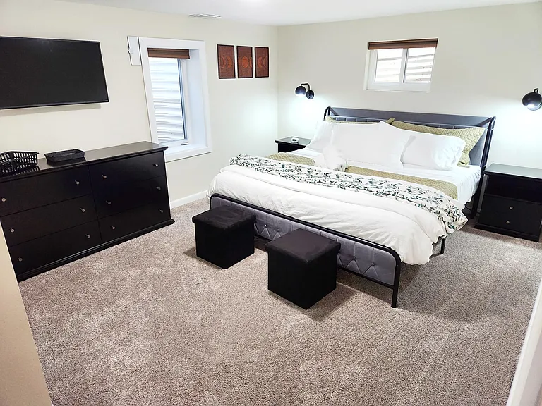 Furnished bedroom with natural light _ mid-term rental for traveling nurses and professionals