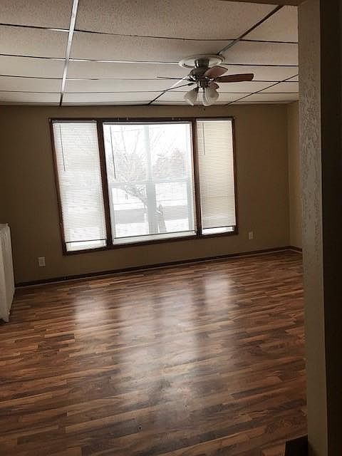 Spacious,light living room with ceiling fan