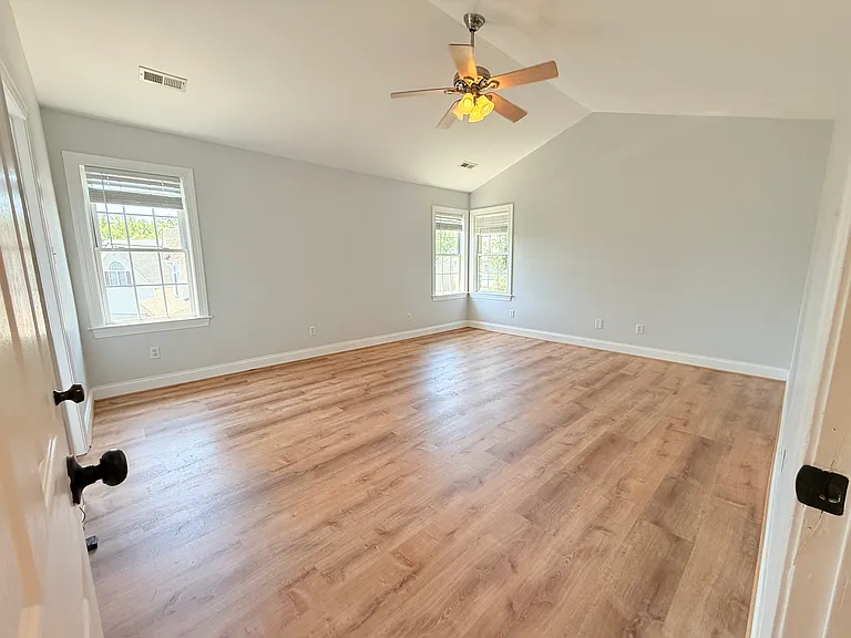 Primary suite located to the right of staircase landing