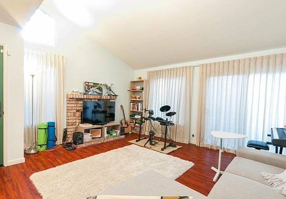 Large living room w sliding doors to backyard