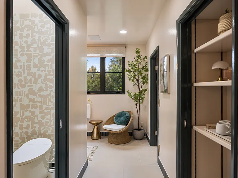 Spacious master bathroom with a secluded toilet area for enhanced privacy and convenience.