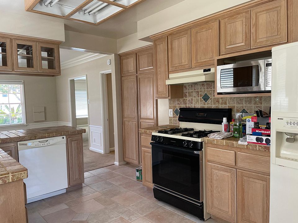 Fuller kitchen shot. Gas stove, microwave and dishwasher. Refrigerator has some years on it, but works well. If tenant wants to replace they will be able to.