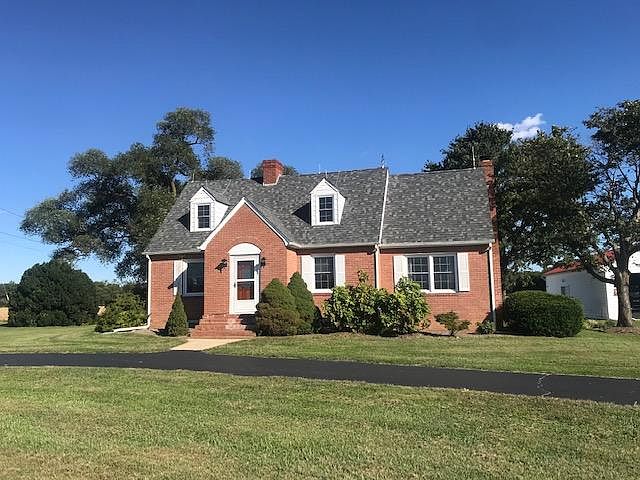 Front view of two story house with basement.