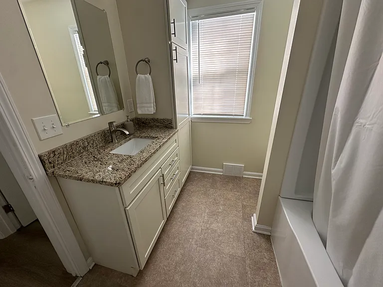 Renovated Full Bathroom with Granite And Extra Storage Cabinets