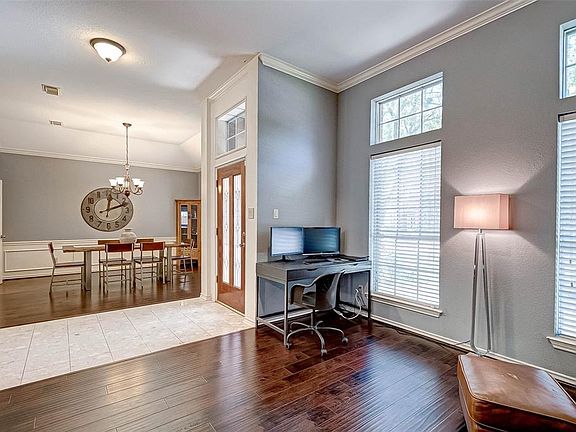 An additional view of the entry way featuring both formal areas.