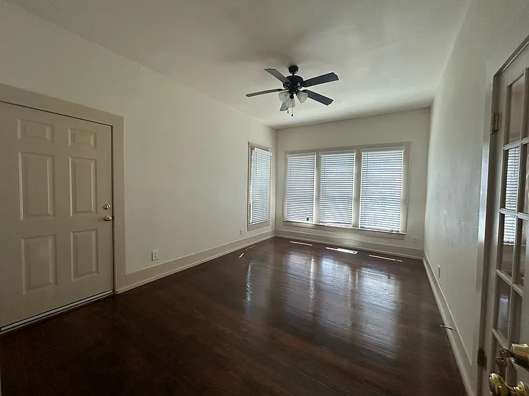 1 of 2 private bedrooms downstairs _ approx. 200 sq.ft. corner room, excellent lighting with 3 large windows!