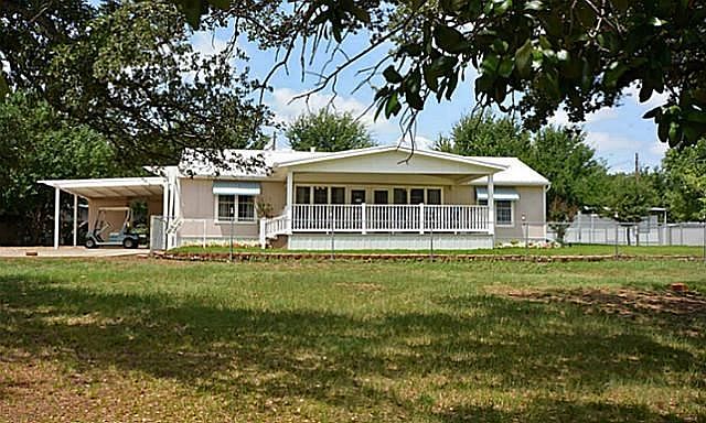 In front of the cottage all has been turned in to no maintenance gravel parking and drive