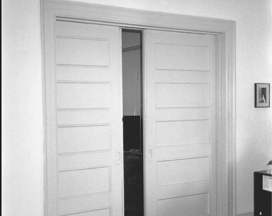 Pocket doors lead to dining room