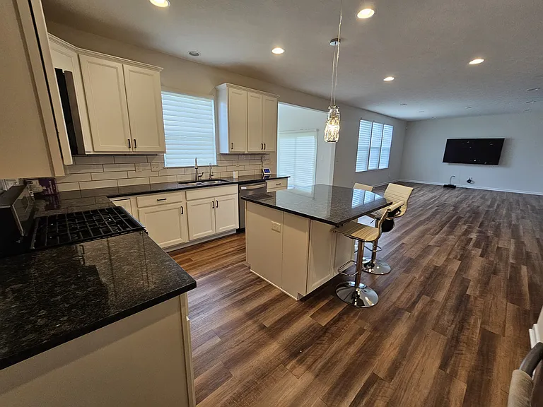 Kitchen looking back into Family Room