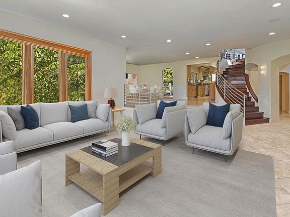 Living room with fireplace and dining area