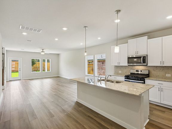 The kitchen in a home of Stewart s Ranch of Conroe, TX.