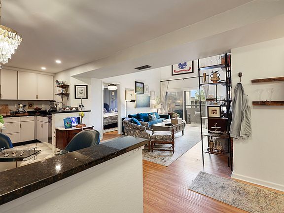 Bright open-concept with seamless flow from kitchen to living space _ perfect for entertaining or relaxing at home.