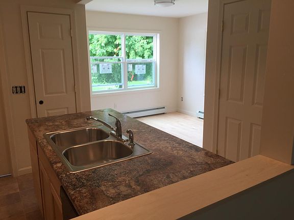 Kitchen to dining room view has eat in bar in kitchen