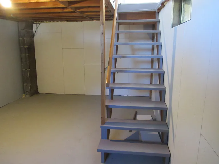 Stairway into basement and storage area.