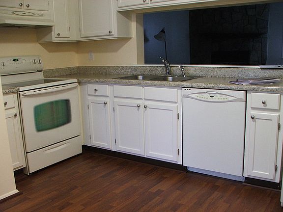 Eat-in kitchen with large windows and Washer Dryer