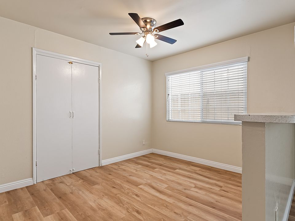 Separate Dining area, ceiling fan with lights, new wood floors and Venetian blinds