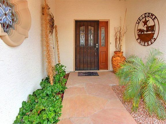 The front entry is very inviting with flagstone walkway!