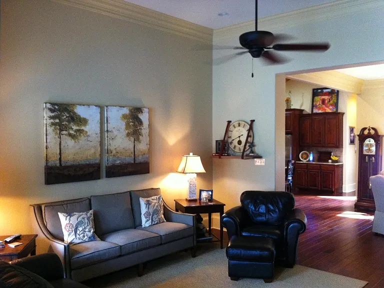 Walking through front door into the living room. Dining room is straight ahead to the right, kitchen is to the left.