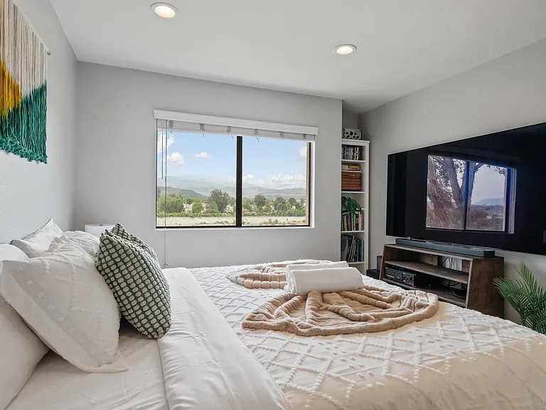 With its serene atmosphere and stylish design, this bedroom is a sanctuary of comfort and relaxation.