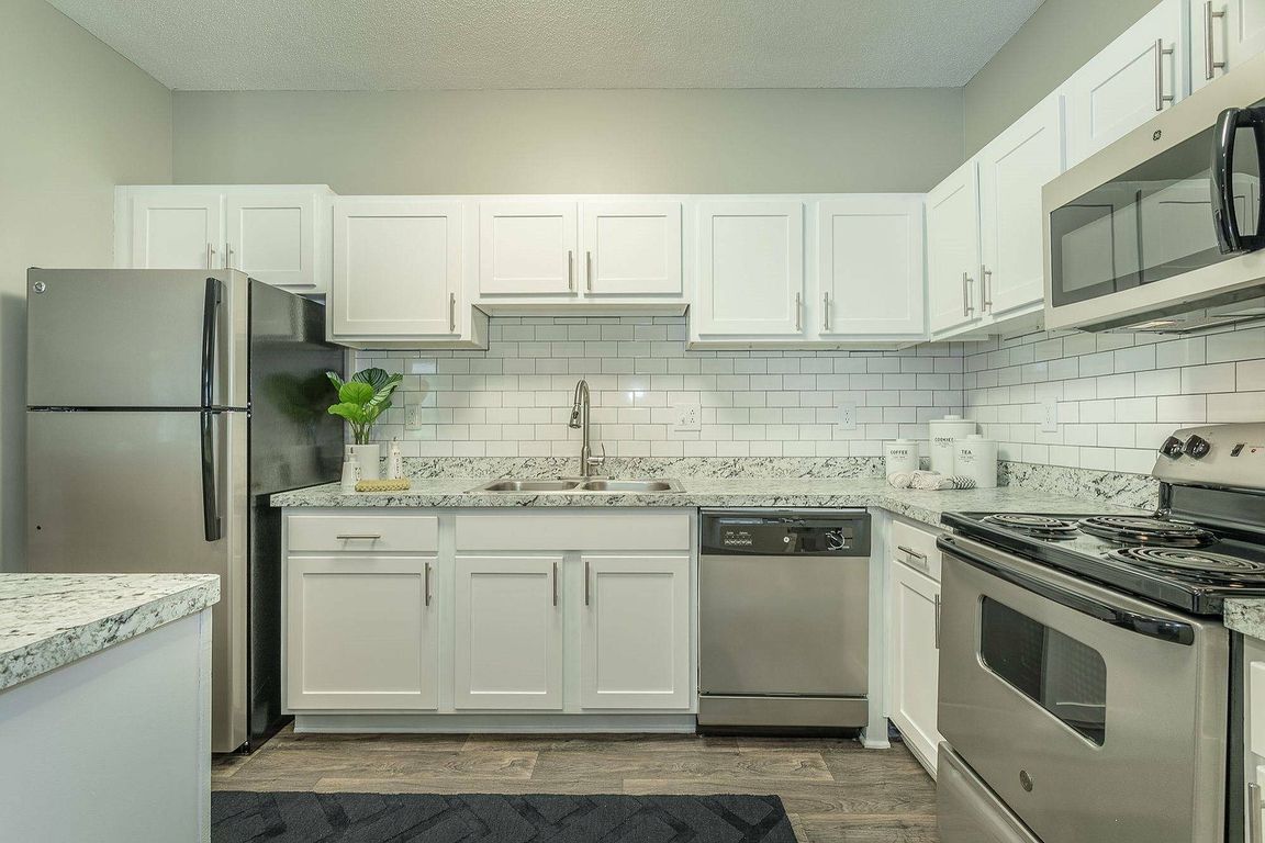 A gourmet kitchen designed for culinary enthusiasts at Avenues of Kennesaw in Kennesaw, GA.