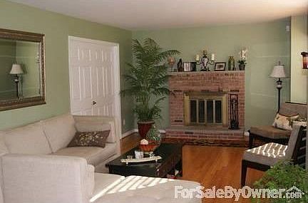 Living Room : Wood fireplace, freshly painted, wood blinds, new hardwood floors