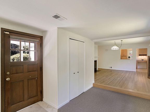 First floor, foyer with coat closet