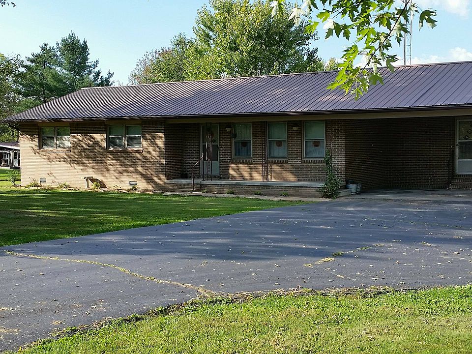 Front view with carport.