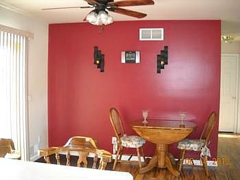 As you step ahead check out the lovely dining room with newly installed laminate wood floor. The dining room also offers patio doors that lead out to your fenced in back yard.