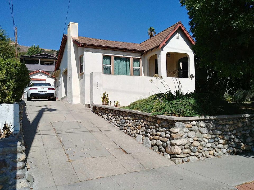 River Rock Retaining Wall surrounds the front yard. New front lawn and automatic sprinklers will be installed prior to move in.
