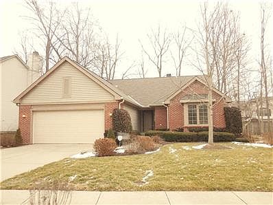 Front View of this maintenance-free brick and vinyl ranch in Fieldstone
