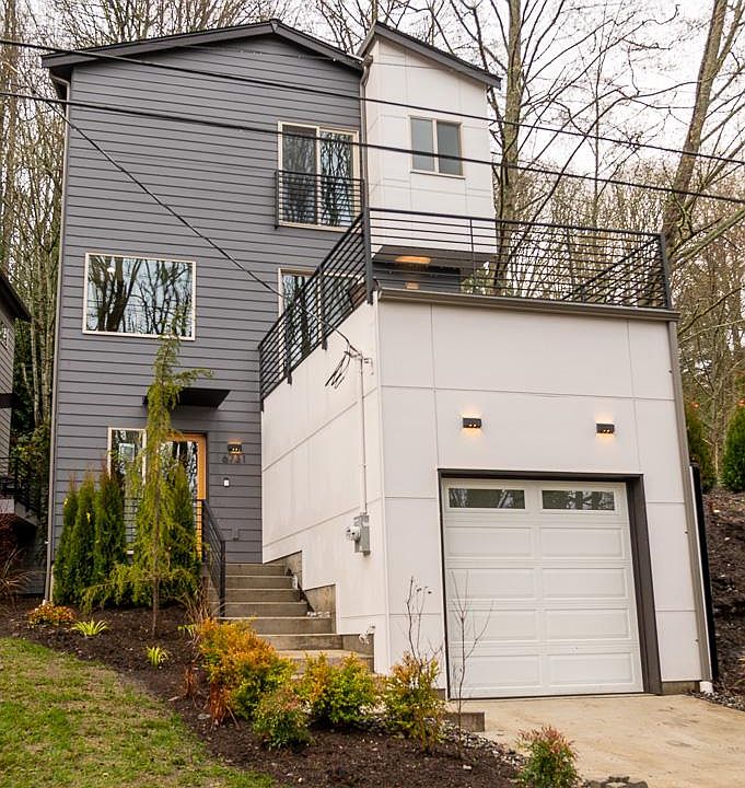 Front yard with garage and concrete driveway