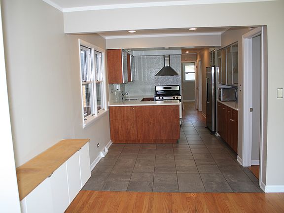 Entryway through dining and kitchen