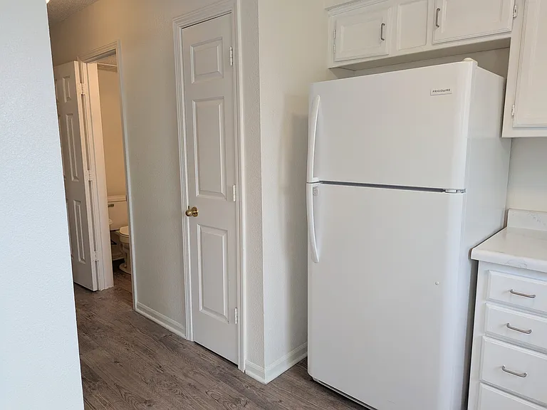 Hallway off of kitchen to 1/2 bath, laundry room and garage