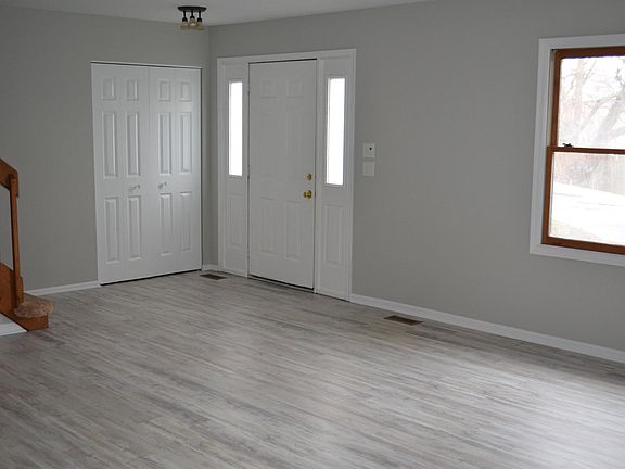 Entry way & Living room/Family Room. Guest closet.