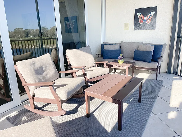 Private Lanai with panoramic screening overlooking 18th green of the Mustang Course at Lely Resort