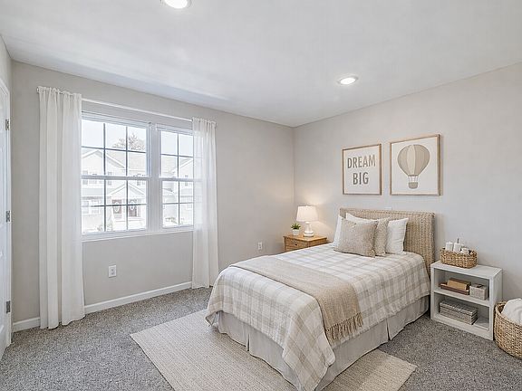 Neutral-toned bedroom with cozy details