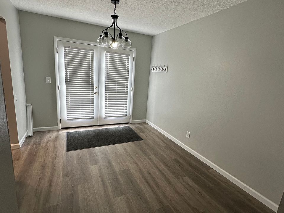 Dining room 10' x11', new vinyl plank flooring with a new French door on to fenced patio