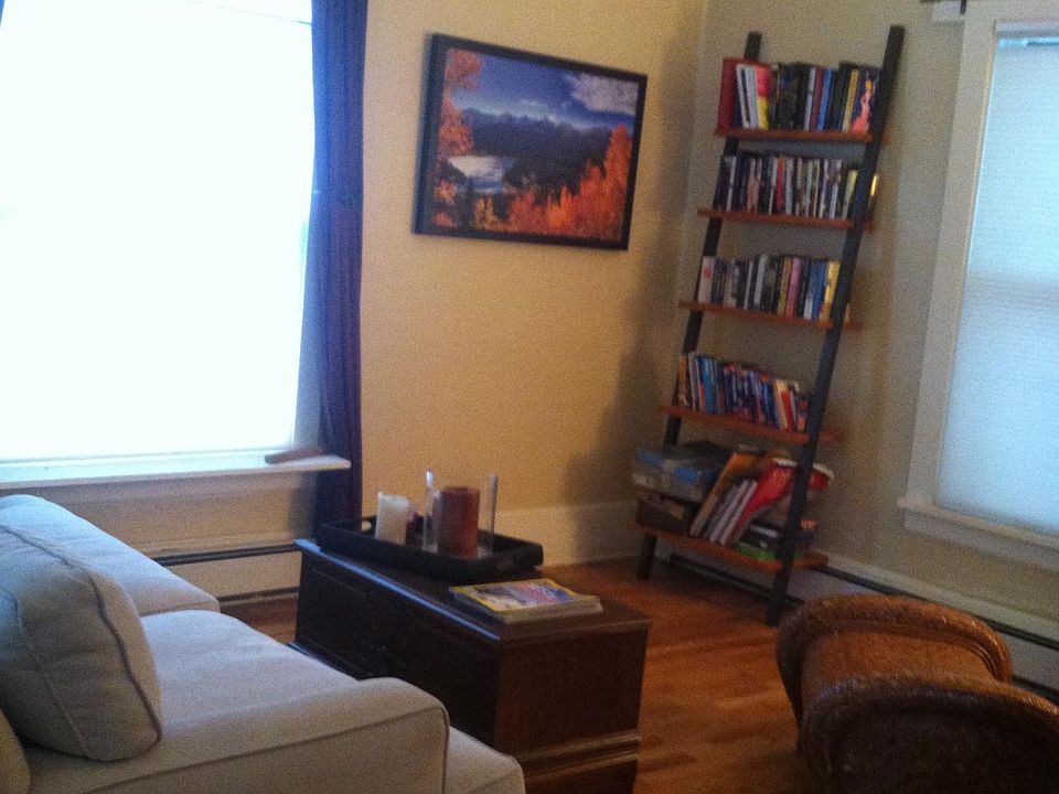 (Previous photo) Plenty of room for a full-size sofa that looks directly out at the Flatirons in winter.