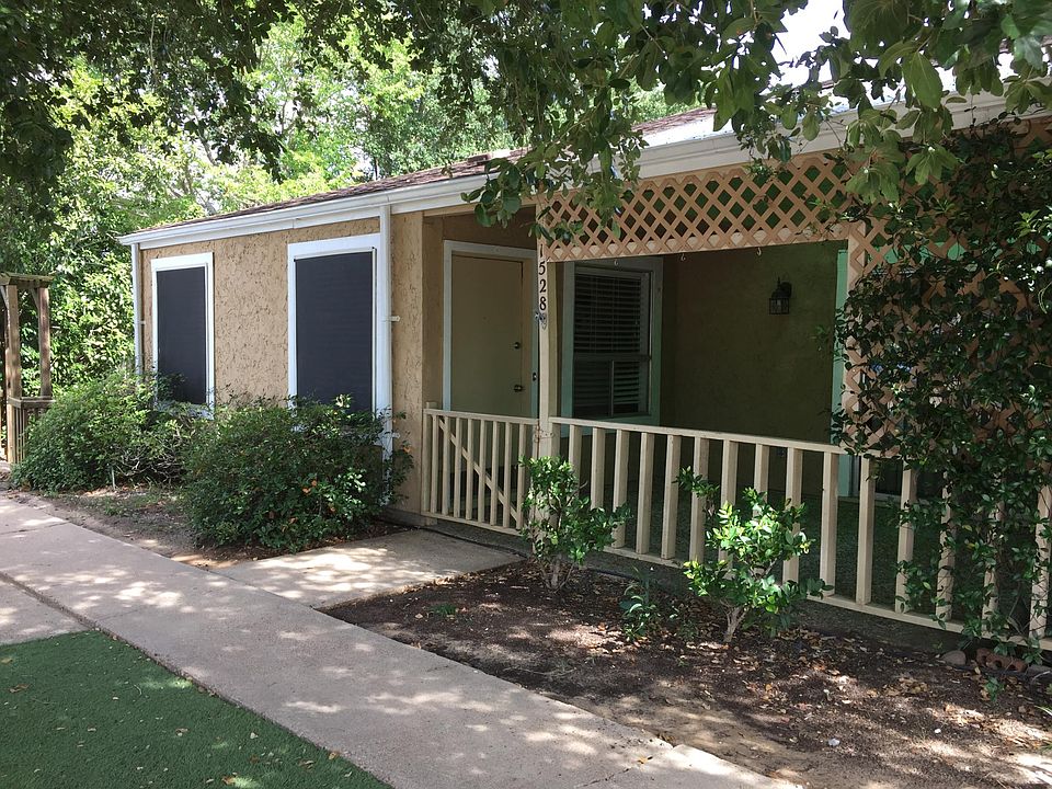 view of front of property, solar screens on windows for more