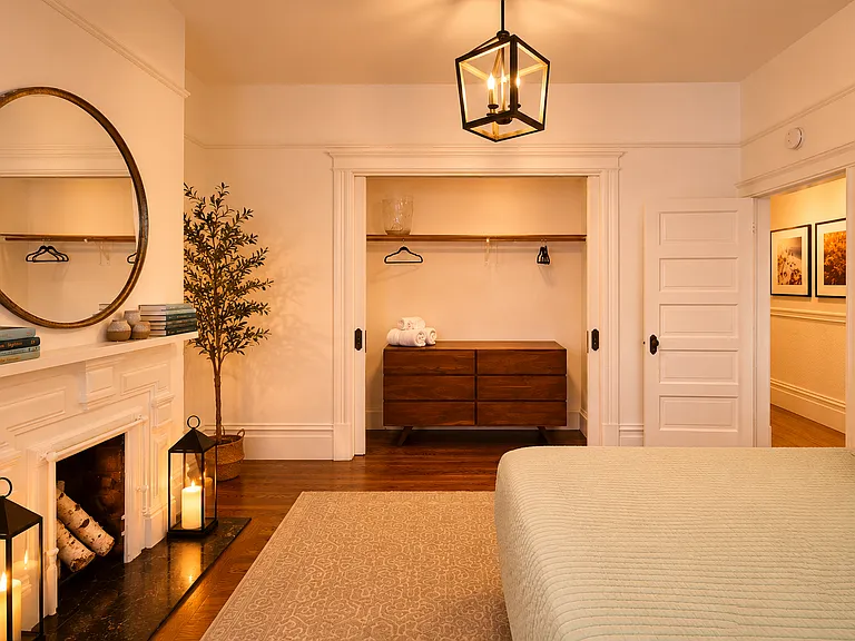 Bedroom #1: Beautifully furnished with a premium queen bed and classic Victorian bay windows overlooking Lyon Street. Generous closet space in every bedroom provides ample storage rarely found in San Francisco homes.