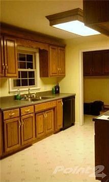 LARGE EAT IN KITCHEN WITH OAK CABINETS / UTILITY ROOM HAS OAK CABINETS AS WELL