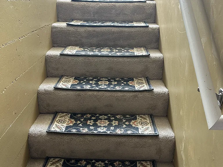 Because I'm trying to keep the light colored carpets clean I added these step rugs.